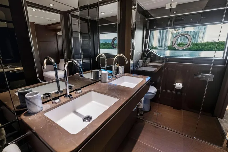  Yacht Photos Pics Luxurious bathroom in 2023 Ferretti Yachts 860, featuring dual sinks and modern fixtures.