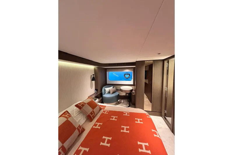  Yacht Photos Pics Luxurious bedroom interior of 2025 Benetti Azimut MAGELLANO 66 yacht, featuring elegant decor.