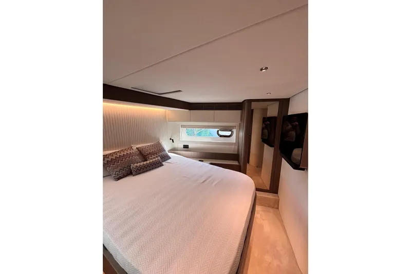  Yacht Photos Pics Luxurious bedroom interior of 2025 Benetti Azimut MAGELLANO 66 yacht, featuring elegant design and cozy ambiance.