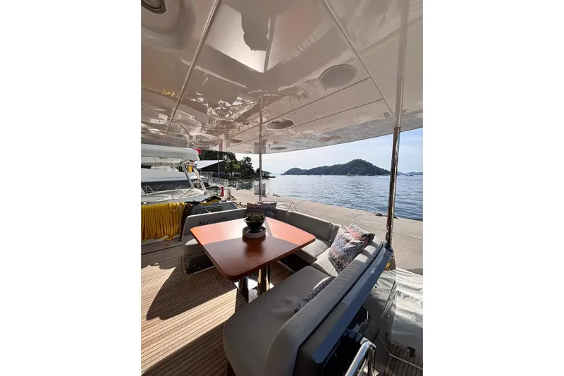  Yacht Photos Pics Luxury yacht Benetti Azimut MAGELLANO 66, 2025 model, with elegant outdoor seating and ocean view.