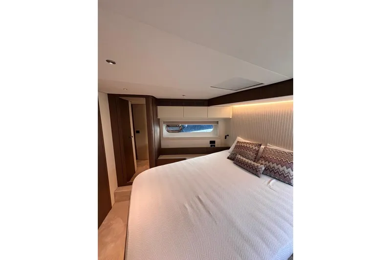  Yacht Photos Pics Luxurious bedroom interior of 2025 Benetti Azimut MAGELLANO 66 yacht, featuring elegant design.