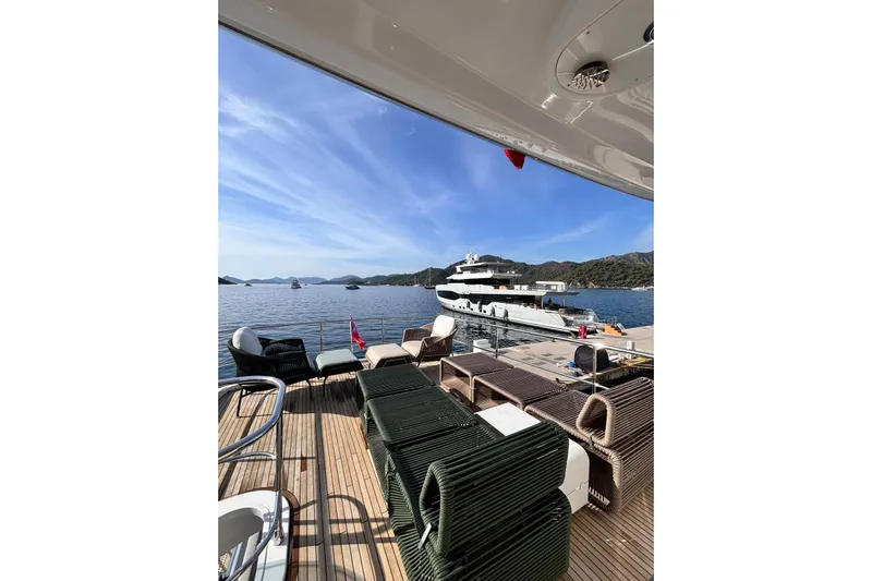  Yacht Photos Pics Luxury yacht Benetti Azimut MAGELLANO 66, 2025 model, docked with scenic ocean view.