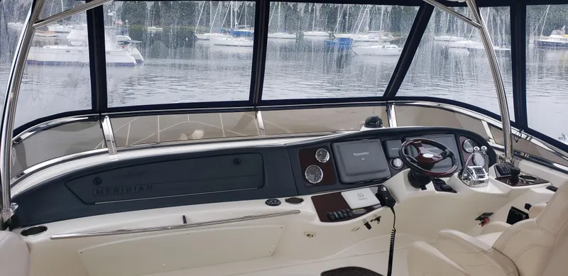  Yacht Photos Pics Interior view of 2010 Meridian 441 Sedan yacht cockpit with navigation controls.