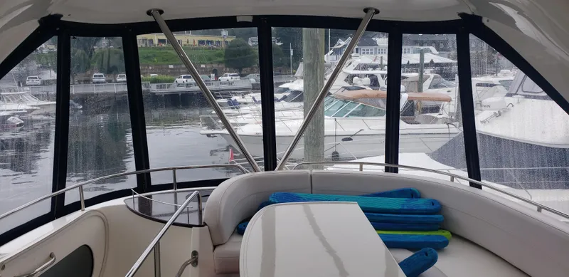  Yacht Photos Pics Interior view of 2010 Meridian 441 Sedan yacht with marina backdrop.