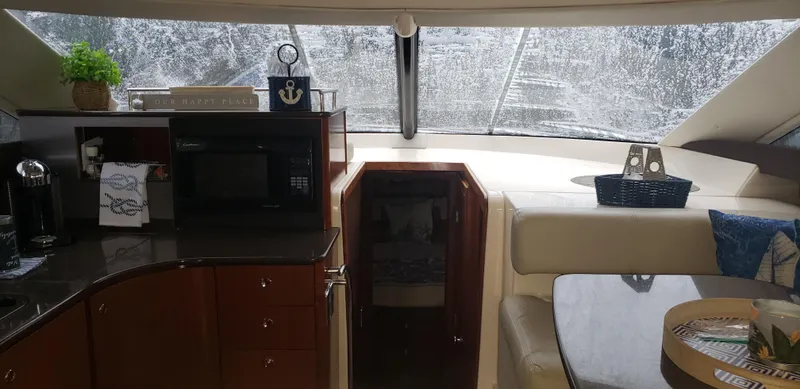  Yacht Photos Pics Interior of 2010 Meridian 441 Sedan yacht with kitchen and seating area.