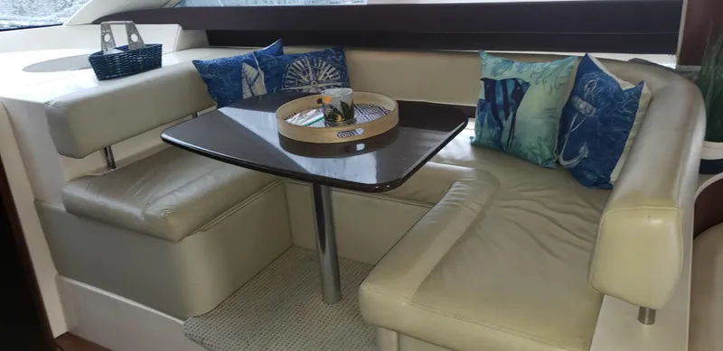  Yacht Photos Pics Luxurious interior of 2010 Meridian 441 Sedan yacht with cozy seating and decorative pillows.