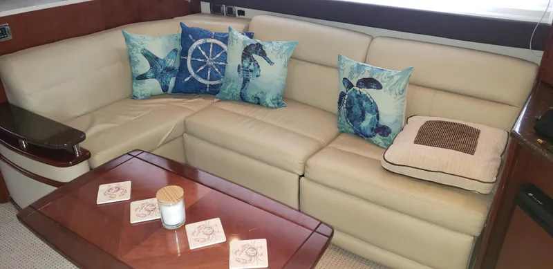  Yacht Photos Pics Luxurious Meridian 441 Sedan 2010 interior with beige leather seating and nautical-themed pillows.