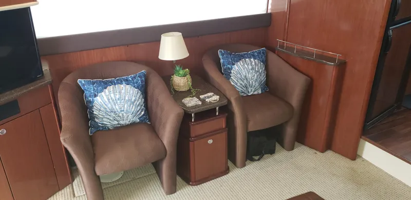  Yacht Photos Pics Interior of 2010 Meridian 441 Sedan with cozy seating and nautical decor.