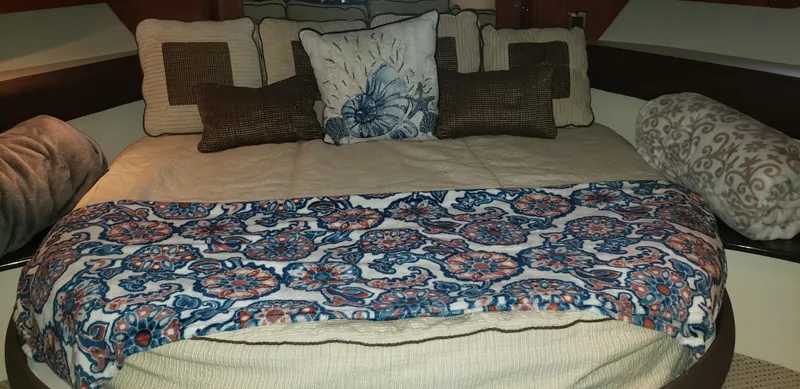  Yacht Photos Pics Cozy bedroom in 2010 Meridian 441 Sedan with patterned bedding and decorative pillows.