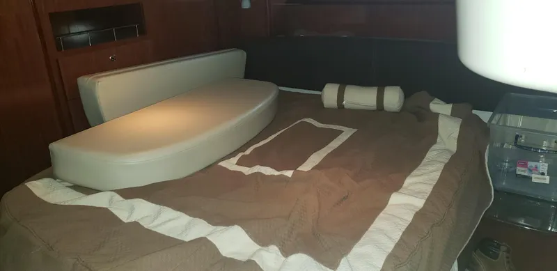  Yacht Photos Pics Interior cabin of 2010 Meridian 441 Sedan with bed and cushions.