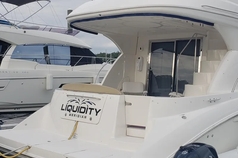  Yacht Photos Pics 2010 Meridian 441 Sedan yacht docked, featuring spacious deck and sleek design.