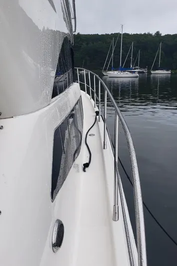  Yacht Photos Pics Side view of 2010 Meridian 441 Sedan yacht on calm water.