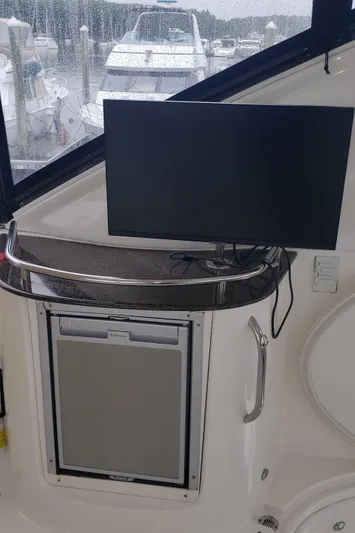  Yacht Photos Pics 2010 Meridian 441 Sedan interior with TV and mini-fridge.