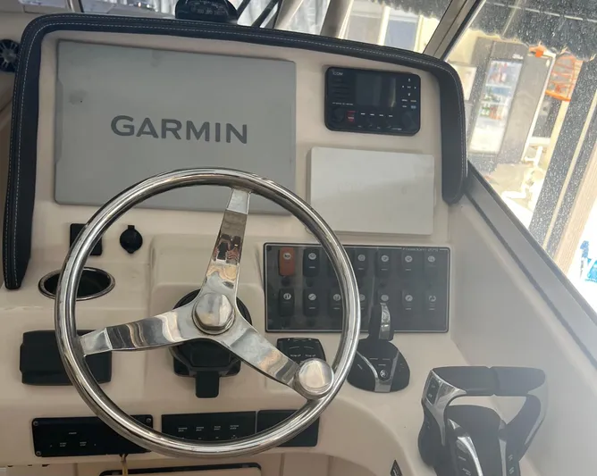  Yacht Photos Pics Control panel of 2022 Grady-White Freedom 275 boat with Garmin navigation system.