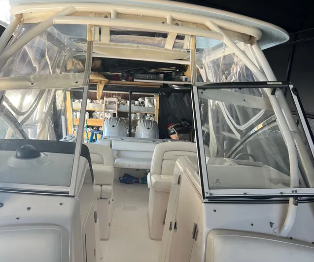  Yacht Photos Pics 2022 Grady-White Freedom 275 boat interior with seating and storage compartments.