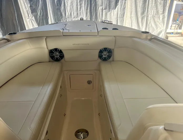  Yacht Photos Pics 2022 Grady-White Freedom 275 boat interior with cushioned seating and speakers.