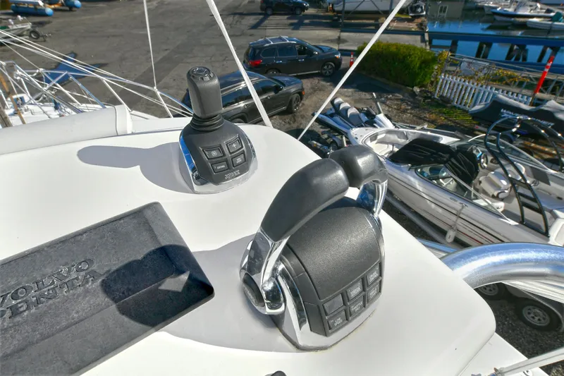 Two & Five Yacht Photos Pics Controls on a 2013 Albemarle 360 Express Fisherman boat, docked with other vessels nearby.