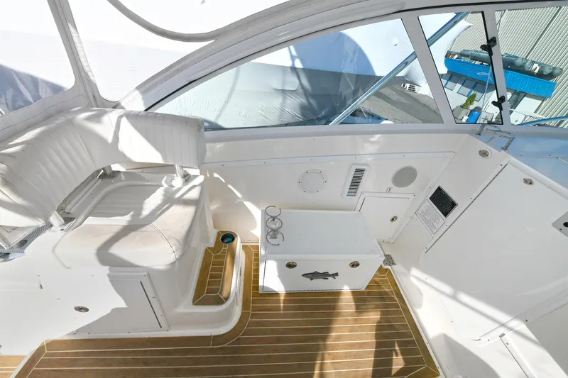 Two & Five Yacht Photos Pics 2013 Albemarle 360 Express Fisherman interior with white seating and wooden flooring.