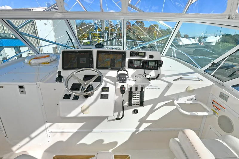 Two & Five Yacht Photos Pics Cockpit of 2013 Albemarle 360 Express Fisherman with navigation equipment and steering wheel.