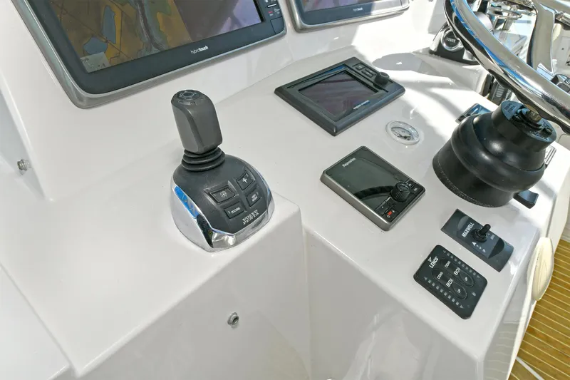 Two & Five Yacht Photos Pics Control panel of 2013 Albemarle 360 Express Fisherman boat with joystick and navigation screens.