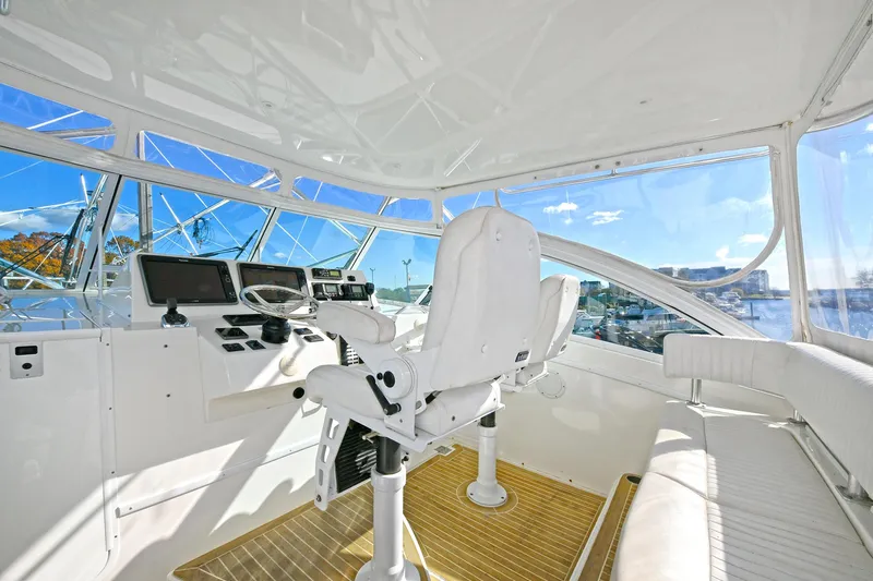 Two & Five Yacht Photos Pics 2013 Albemarle 360 Express Fisherman cockpit with white seating and navigation controls.