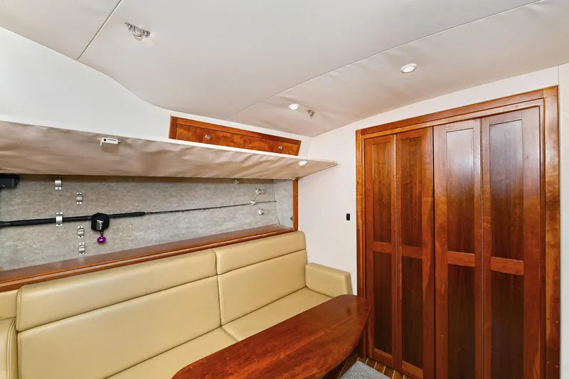Two & Five Yacht Photos Pics Interior of 2013 Albemarle 360 Express Fisherman with beige seating and wooden cabinetry.