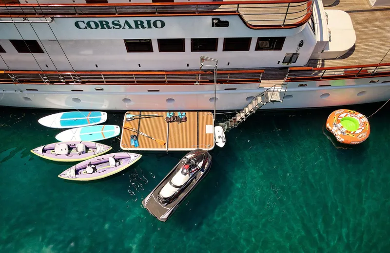 Corsario Yacht Photos Pics Aerial view of 2019 Custom RADEŽ d.d. Schooner with paddleboards and a tender in clear water.