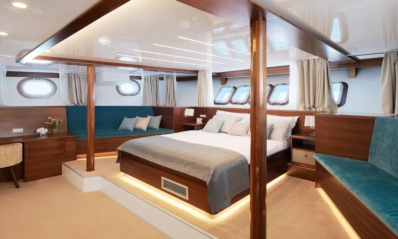 Corsario Yacht Photos Pics Luxurious cabin interior of 2019 Custom RADEŽ d.d. Schooner with modern wooden design and ambient lighting.
