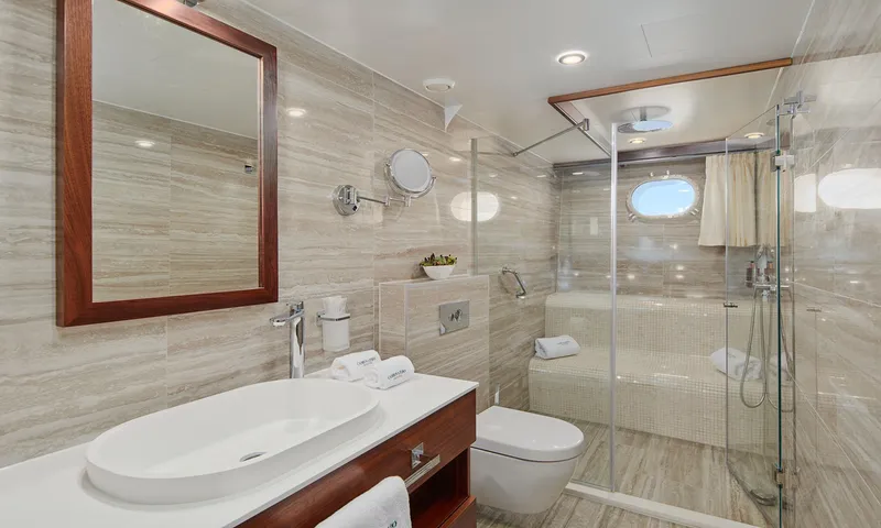 Corsario Yacht Photos Pics Luxurious bathroom on a 2019 Custom RADEŽ d.d. Schooner with modern fixtures and glass shower.