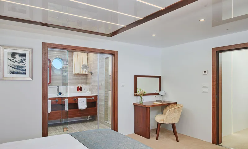 Corsario Yacht Photos Pics Luxurious cabin interior of 2019 Custom RADEŽ d.d. Schooner with ensuite bathroom and vanity desk.