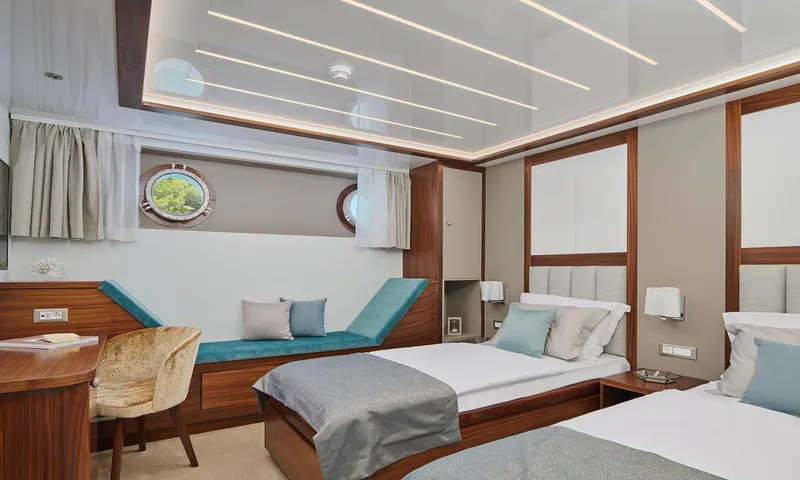 Corsario Yacht Photos Pics Luxurious cabin interior of 2019 Custom RADEŽ d.d. Schooner with twin beds and modern decor.
