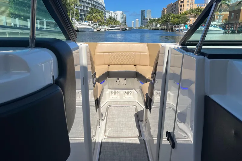 Helena Yacht Photos Pics 2020 Sea Ray 280 SLX boat interior with tan seating, docked in a scenic marina.