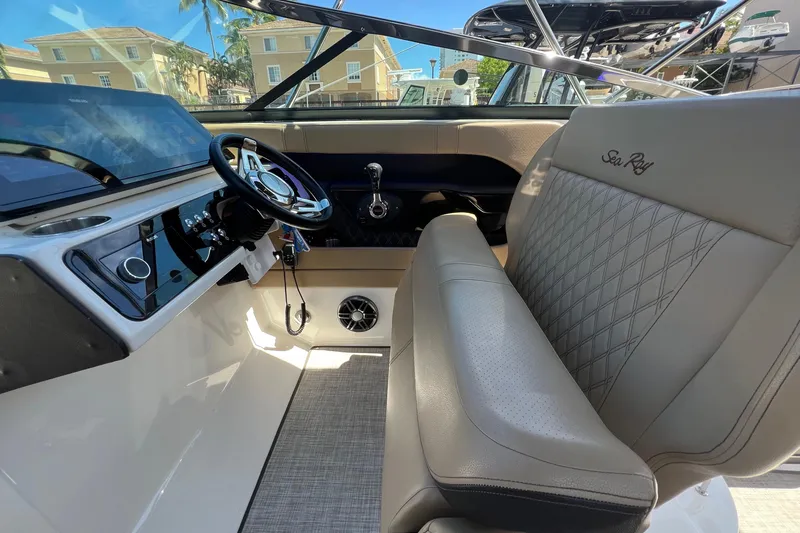 Helena Yacht Photos Pics 2020 Sea Ray 280 SLX boat interior with steering wheel and luxurious seating.