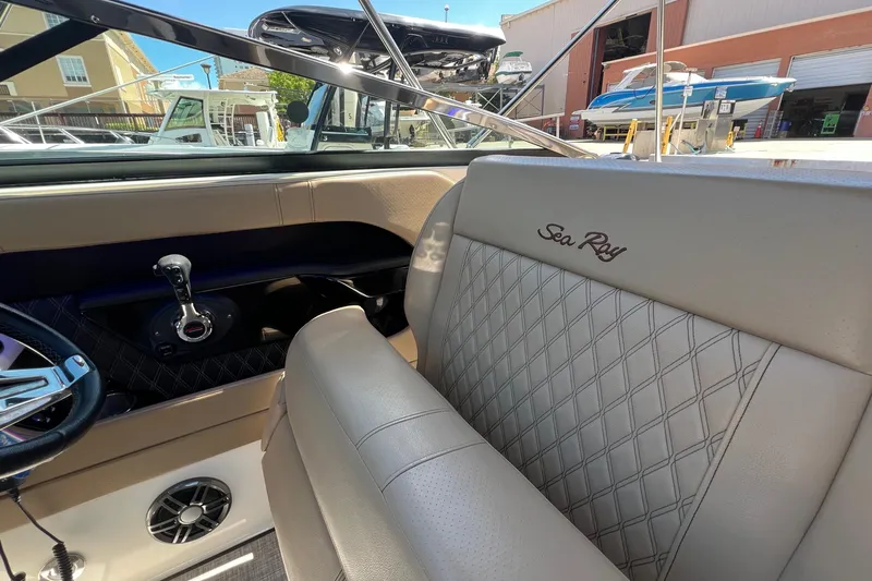 Helena Yacht Photos Pics Interior of 2020 Sea Ray 280 SLX boat with luxurious seating and steering controls.