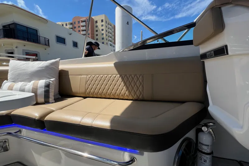 Helena Yacht Photos Pics Luxurious seating on 2020 Sea Ray 280 SLX boat with cushions and blue LED lighting.