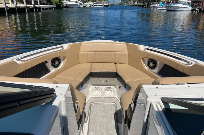 Helena Yacht Photos Pics 2020 Sea Ray 280 SLX boat interior with tan seating, docked on a calm waterway.
