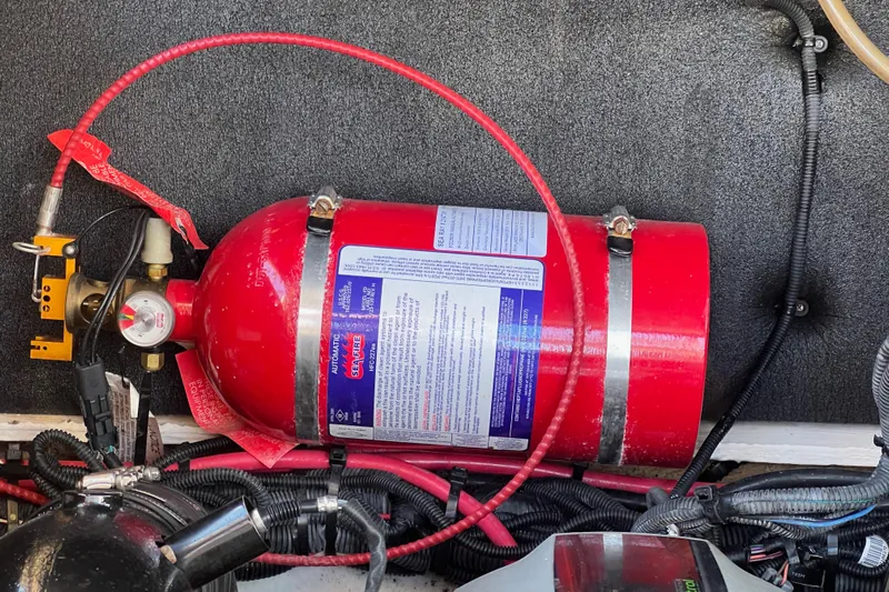 Helena Yacht Photos Pics Red fire extinguisher in a 2020 Sea Ray 280 SLX boat engine compartment.