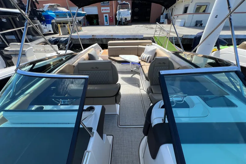 Helena Yacht Photos Pics 2020 Sea Ray 280 SLX boat interior with seating and table, docked at marina.