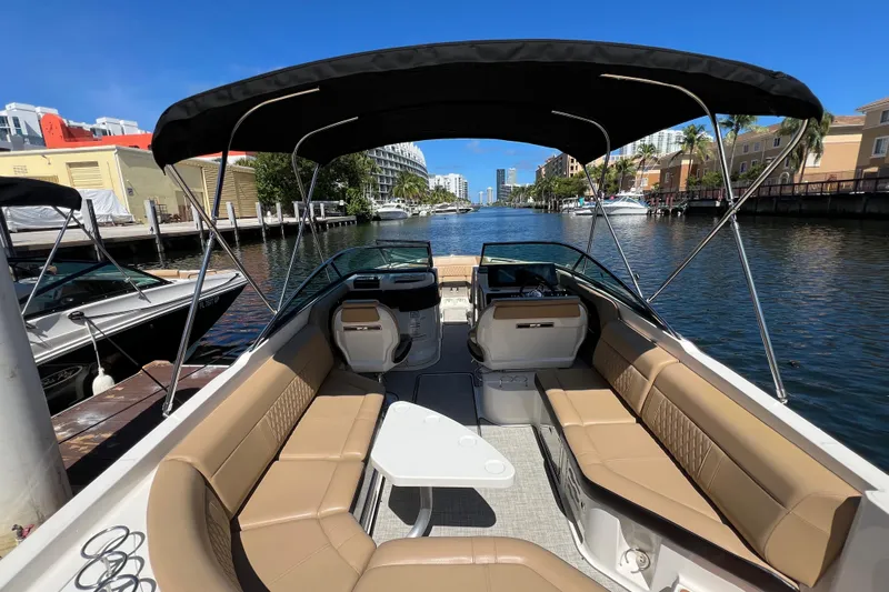 Helena Yacht Photos Pics 2020 Sea Ray 280 SLX boat with spacious seating, docked in a scenic canal.