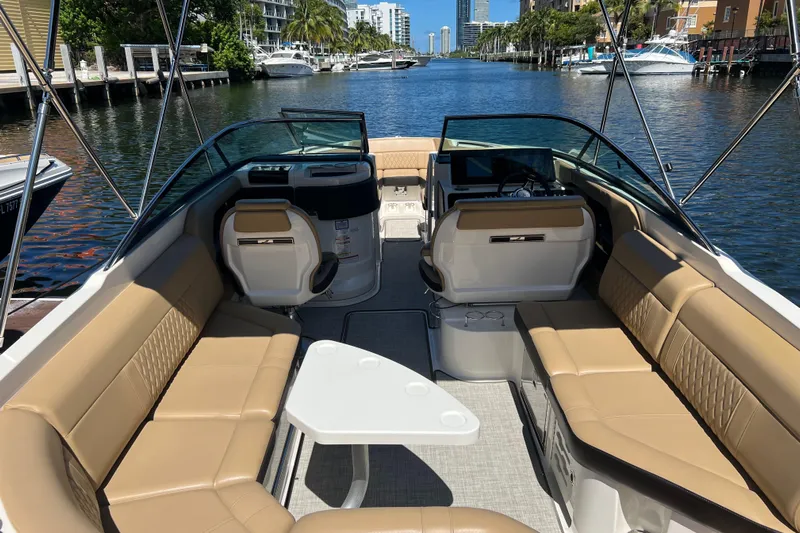 Helena Yacht Photos Pics 2020 Sea Ray 280 SLX boat interior with tan seating, table, and waterfront view.