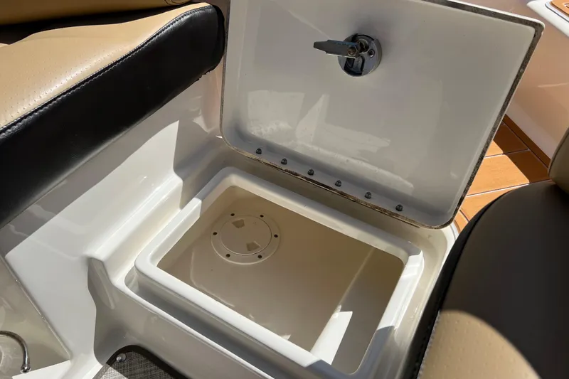Helena Yacht Photos Pics Open storage compartment on 2020 Sea Ray 280 SLX boat, featuring beige and black seating.