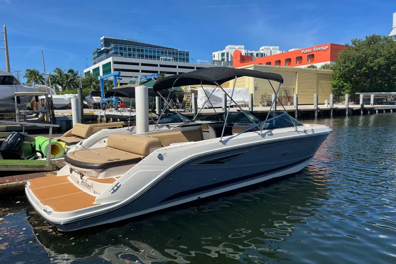 Helena Yacht Photos Pics 2020 Sea Ray 280 SLX boat docked at marina with modern buildings in background.