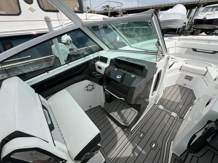 Blackfin Yacht Photos Pics 2023 Blackfin 272DC boat interior with modern dashboard and seating.