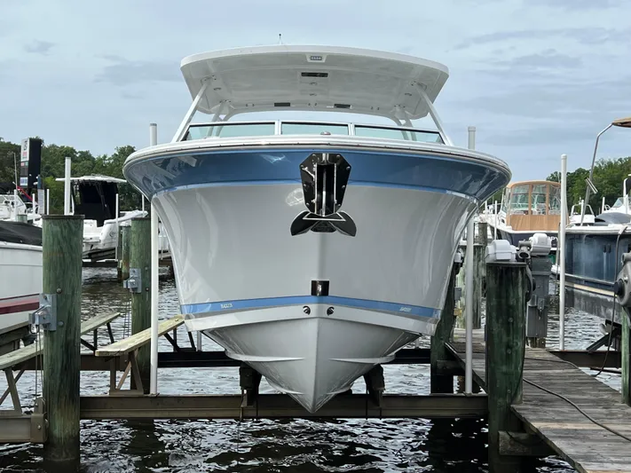 Blackfin Yacht Photos Pics 2023 Blackfin 272DC boat docked at a marina, front view.