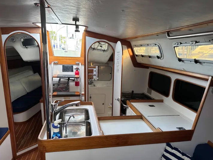 Valcor II Yacht Photos Pics Interior of 1996 J Boats J/42 sailboat with kitchen and seating area.