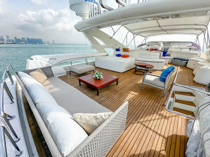 Eaglewings 3 Yacht Photos Pics Luxurious 2005 Custom Line 112 yacht deck with elegant seating and ocean view.