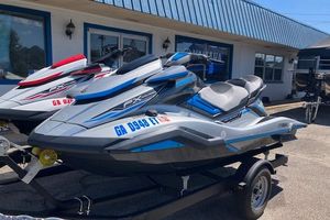 2020 Yamaha WaveRunner FX Cruiser HO jet ski on trailer, parked outside dealership.