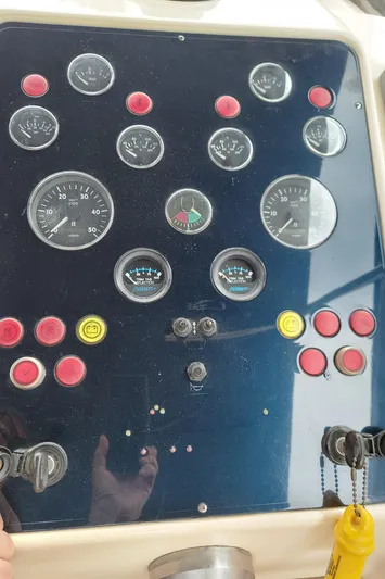 No Name Yacht Photos Pics Control panel of a 2001 Apreamare 10M Cabinato boat with gauges and buttons.