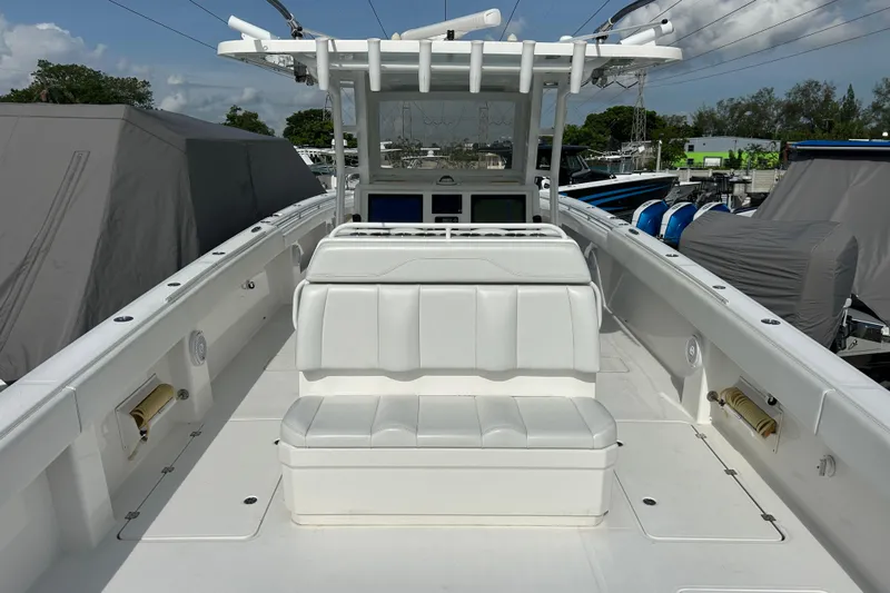  Yacht Photos Pics 2019 Invincible 40 Catamaran with white seating and spacious deck in a marina setting.