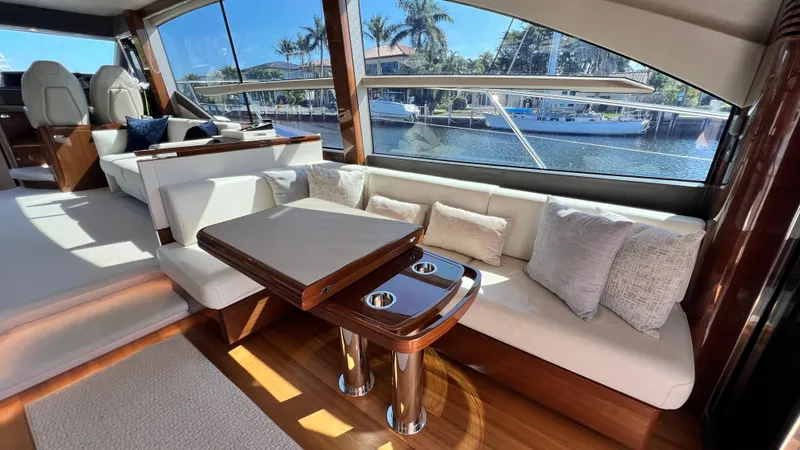  Yacht Photos Pics Luxurious 2019 Princess F62 yacht interior with elegant seating and waterfront view.